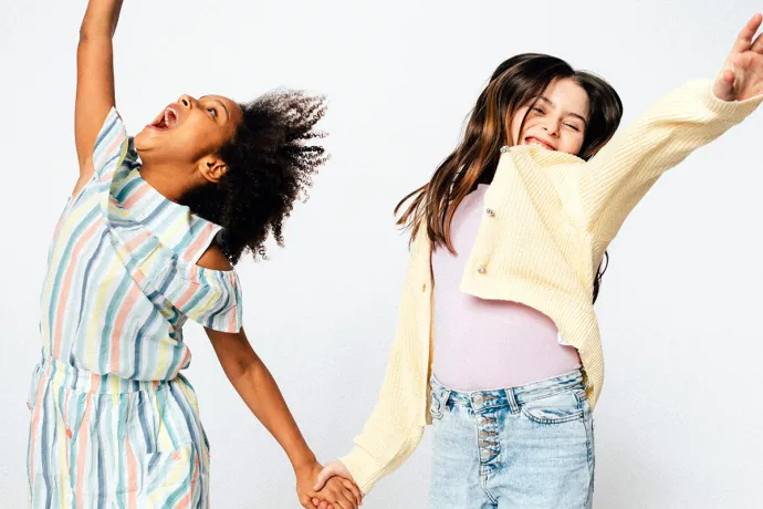 two girls jumping